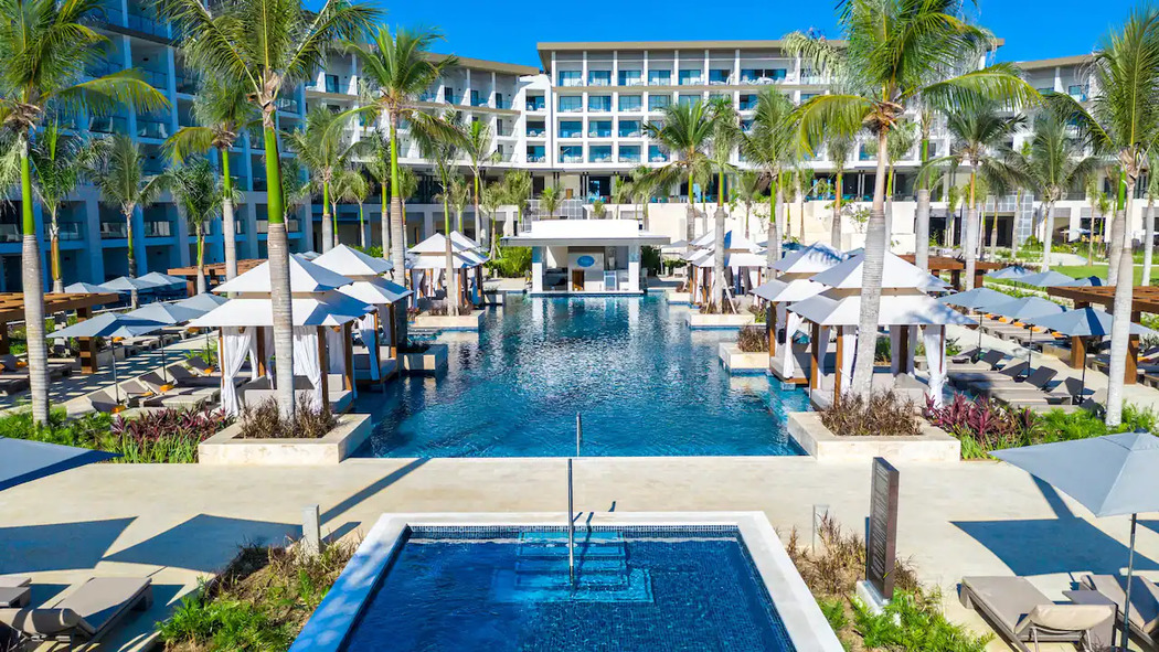 pool cabanas and resort buildings at Hyatt Zilara Cap Cana