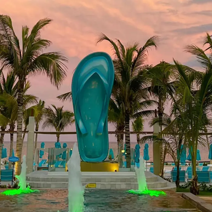 typical Margaritaville Island Reserve Riviera Maya flip flop surrounded by a water feature
