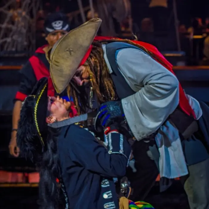 Captain Hook Cancun pirate fight, showing two pirates engaged in a sword fight during the dinner show