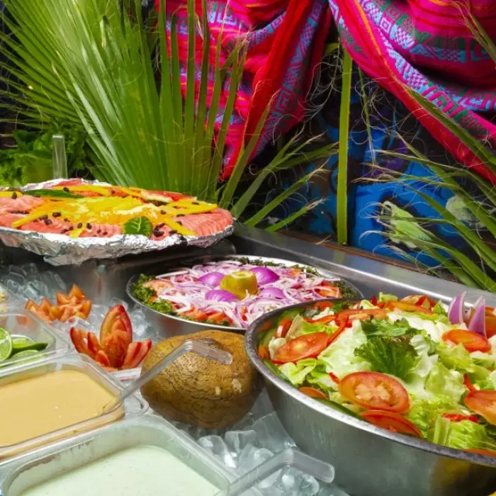 Captain Hook Cancun dinner buffet, close-up of the salad bar with fresh ingredients and dressings