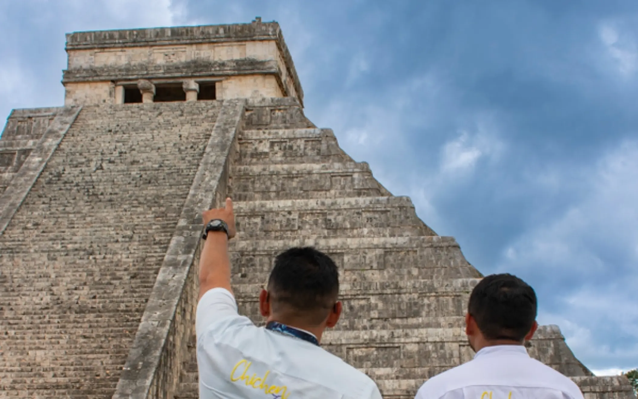 Knowledgeable tour guides at Chichen Itza, explaining the ancient site's history and significance.
