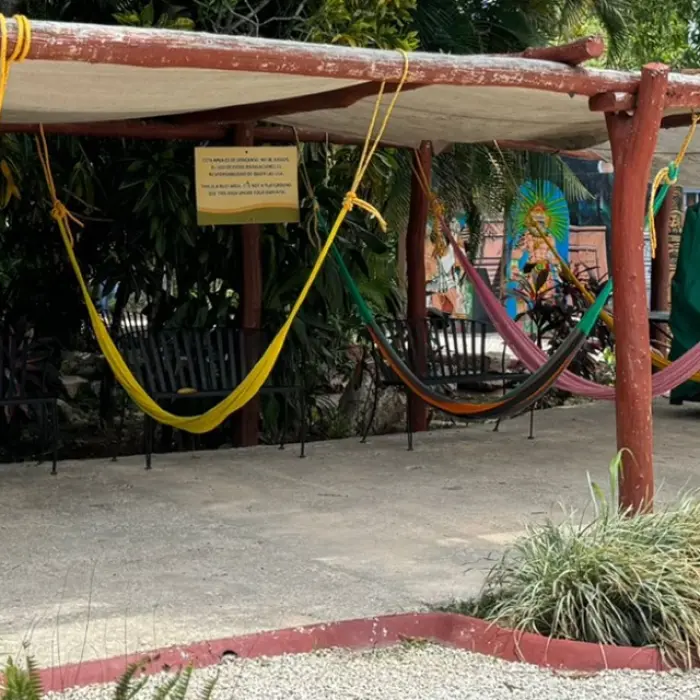 Traditional hammocks at Chichen Itza, offering a relaxing view of the lush surroundings