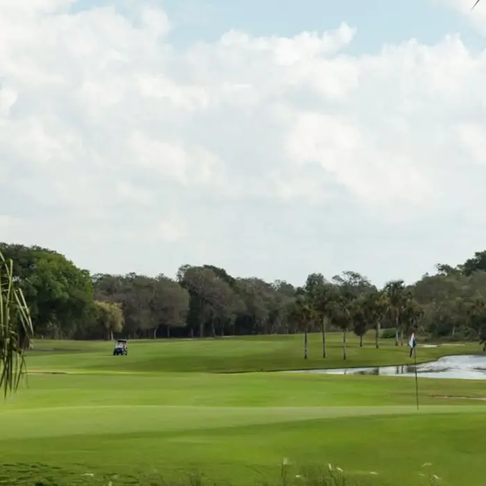 A peaceful view of the perfectly maintained fairway and lake at the Nick Price-designed Gran Coyote golf course.