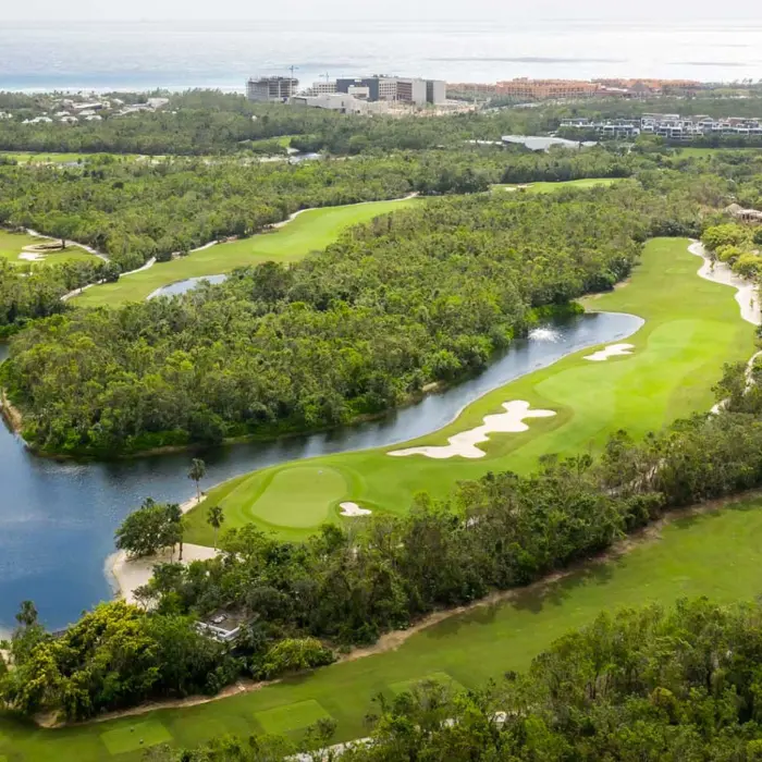 An expansive aerial view showing the beautiful lakes and tropical jungle layout of the 18-hole Gran Coyote championship course.