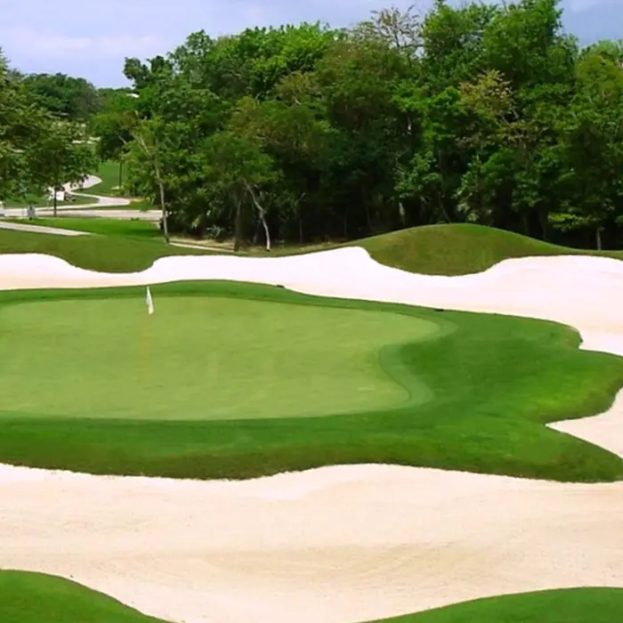 Wide fairways and challenging sand bunkers beautifully carved into the lush tropical landscape of the championship golf course.