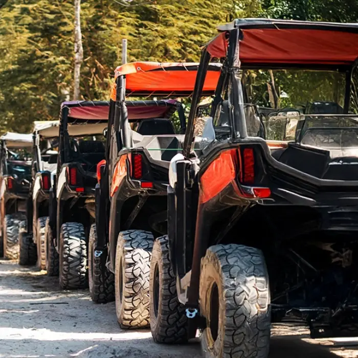 A line of buggies preparing to start an off-road jungle adventure in the Riviera Maya