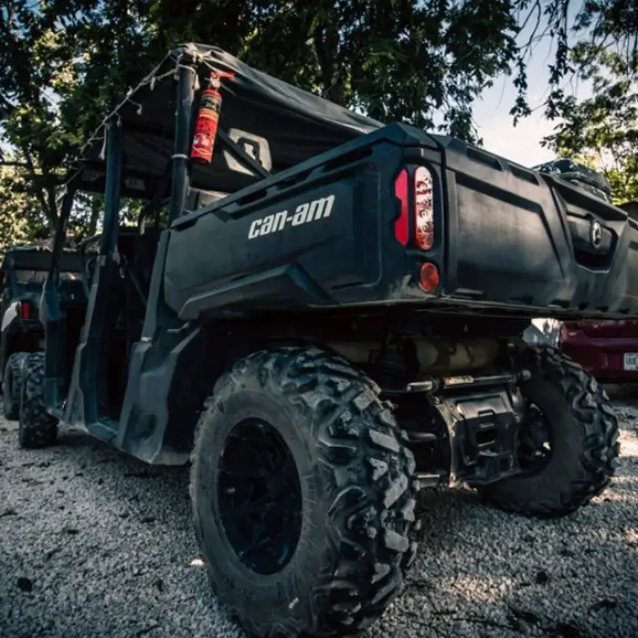 A buggy speeding through a dusty jungle trail in a buggy tour in the Riviera Maya Mexico