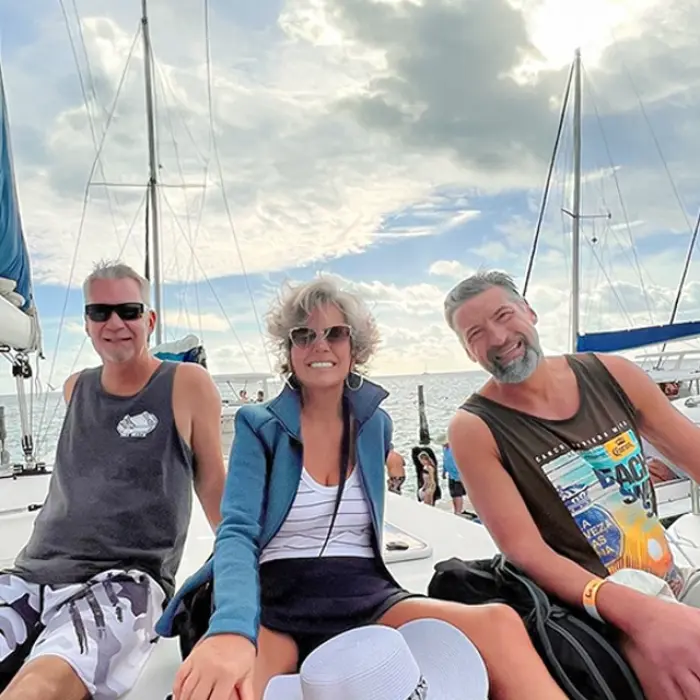 Friends enjoying the open bar on a luxury catamaran in the Caribbean
