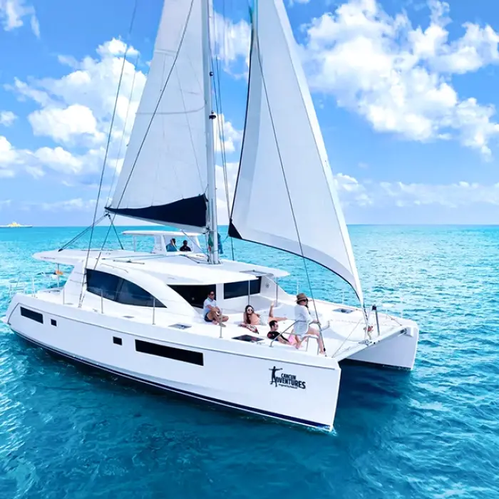 Luxury sailing catamaran gliding across the turquoise waters of the Riviera Maya