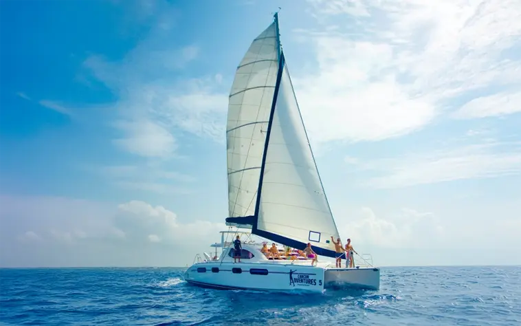 Luxury catamaran sailing and snorkeling tour in the Riviera Maya, offering a premium Caribbean experience with an open bar, gourmet lunch, and water activities like snorkeling at Inah Reef and paddleboarding. Enjoy breathtaking views, crystal-clear waters, and top-tier amenities on this all-inclusive catamaran adventure