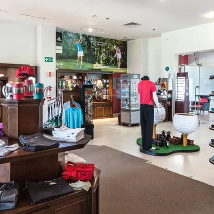 A well-appointed pro shop at Riviera Cancún Golf Club offering high-end golf apparel, premium gear, and accessories