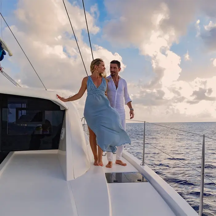Elegant couple enjoying a sunset sail in Playa del Carmen
