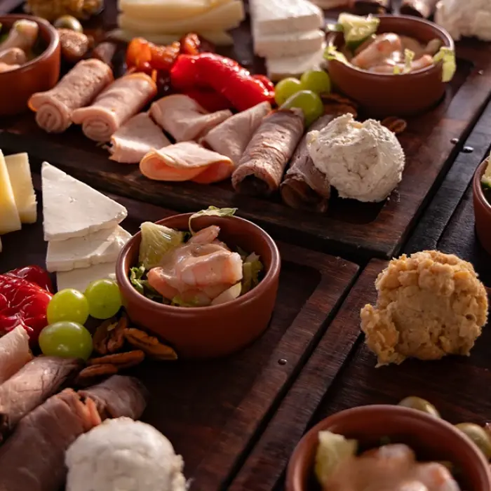 Close-up of appetizers and drinks on a sunset sail in Playa del Carmen. Delicious treats!