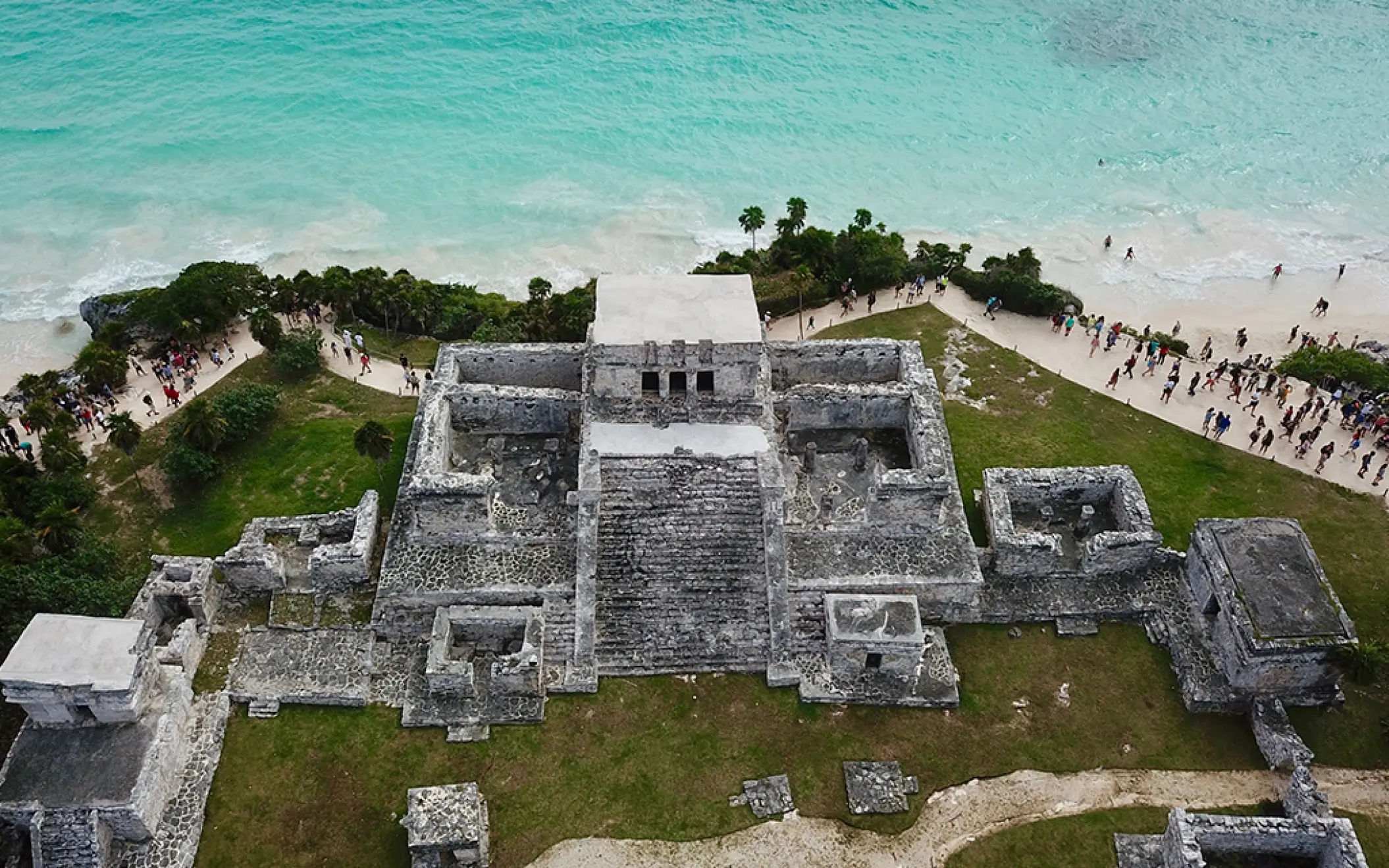 Breathtaking aerial view of the ancient Mayan ruins overlooking the turquoise Caribbean Sea in Tulum