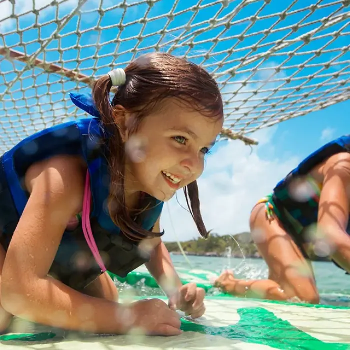 Girls smiling ready for an underwater adventure in the crystal-clear waters of Xel-Há