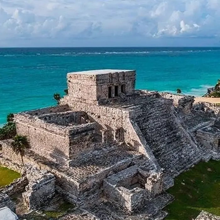 Tulum Mayan ruins perched on a cliff overlooking the stunning turquoise Caribbean Sea. History and beauty!
