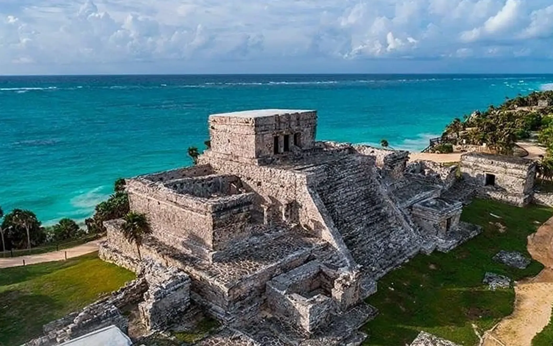 Tulum Mayan ruins perched on a cliff overlooking the stunning turquoise Caribbean Sea. History and beauty!