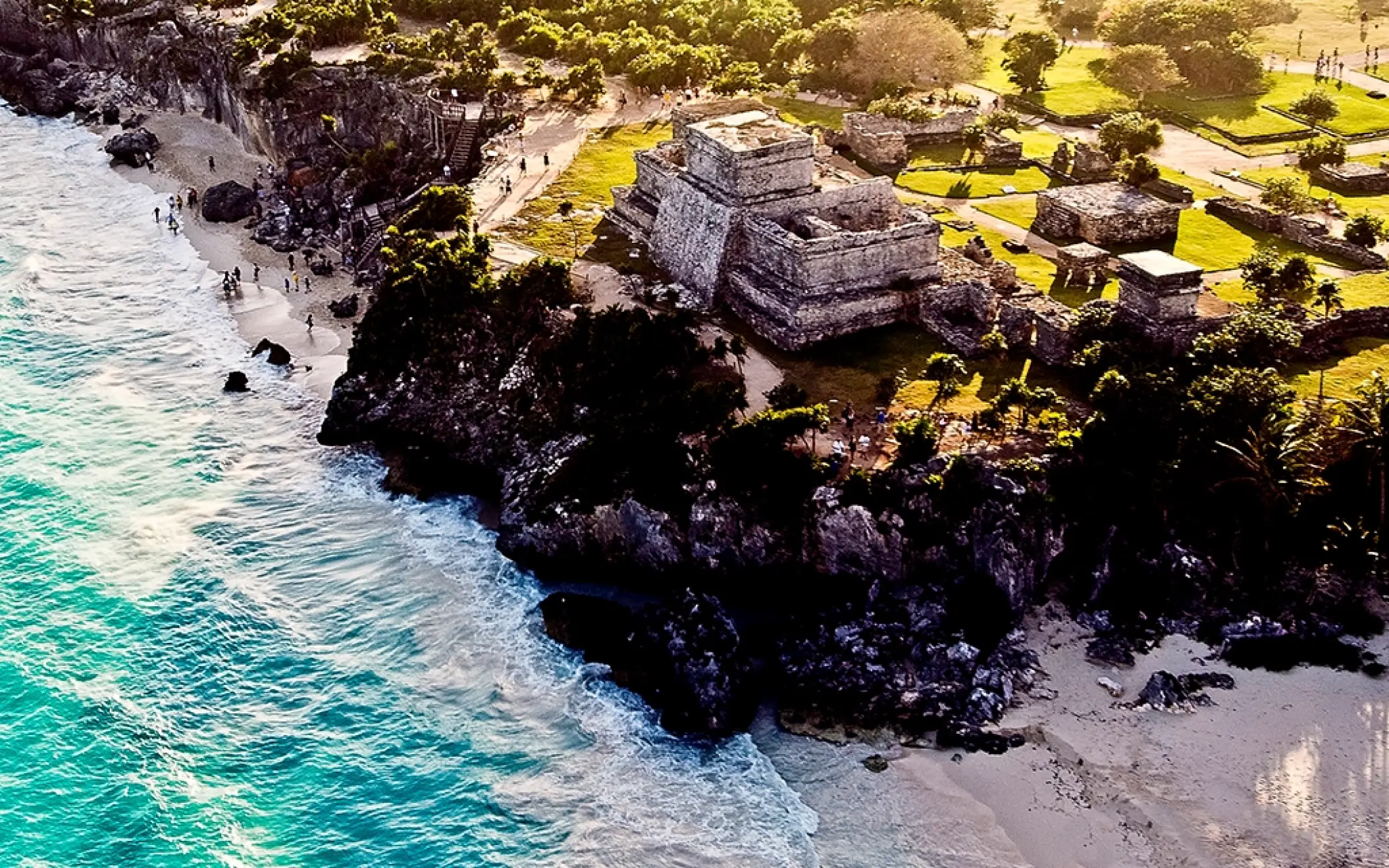 Drone shot of the Tulum archaeological site overlooking the Caribbean Sea, featured in the Tulum Xtreme Tour