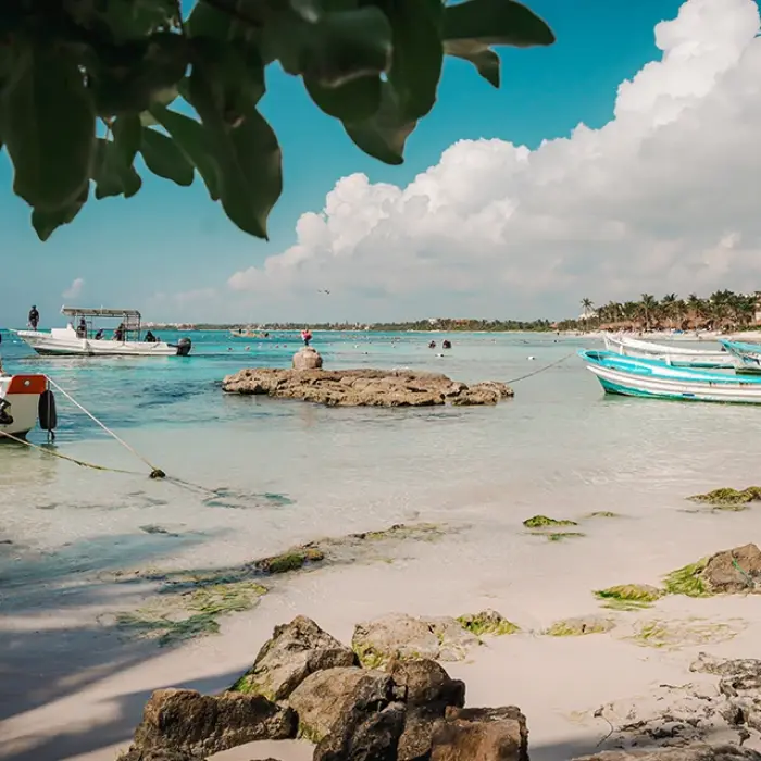 Akumal Bay boats: Several boats anchored in the shallow, clear turquoise waters of Akumal Bay