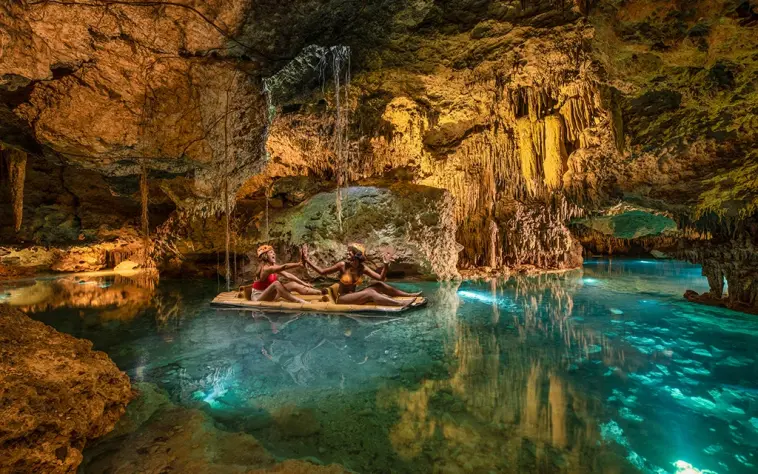 Floating peacefully inside a glowing cave river at Xplor Park