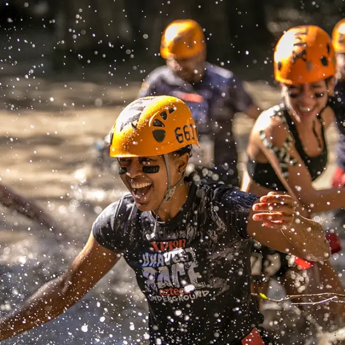 Sliding face-first through a jungle water slide at Xplor
