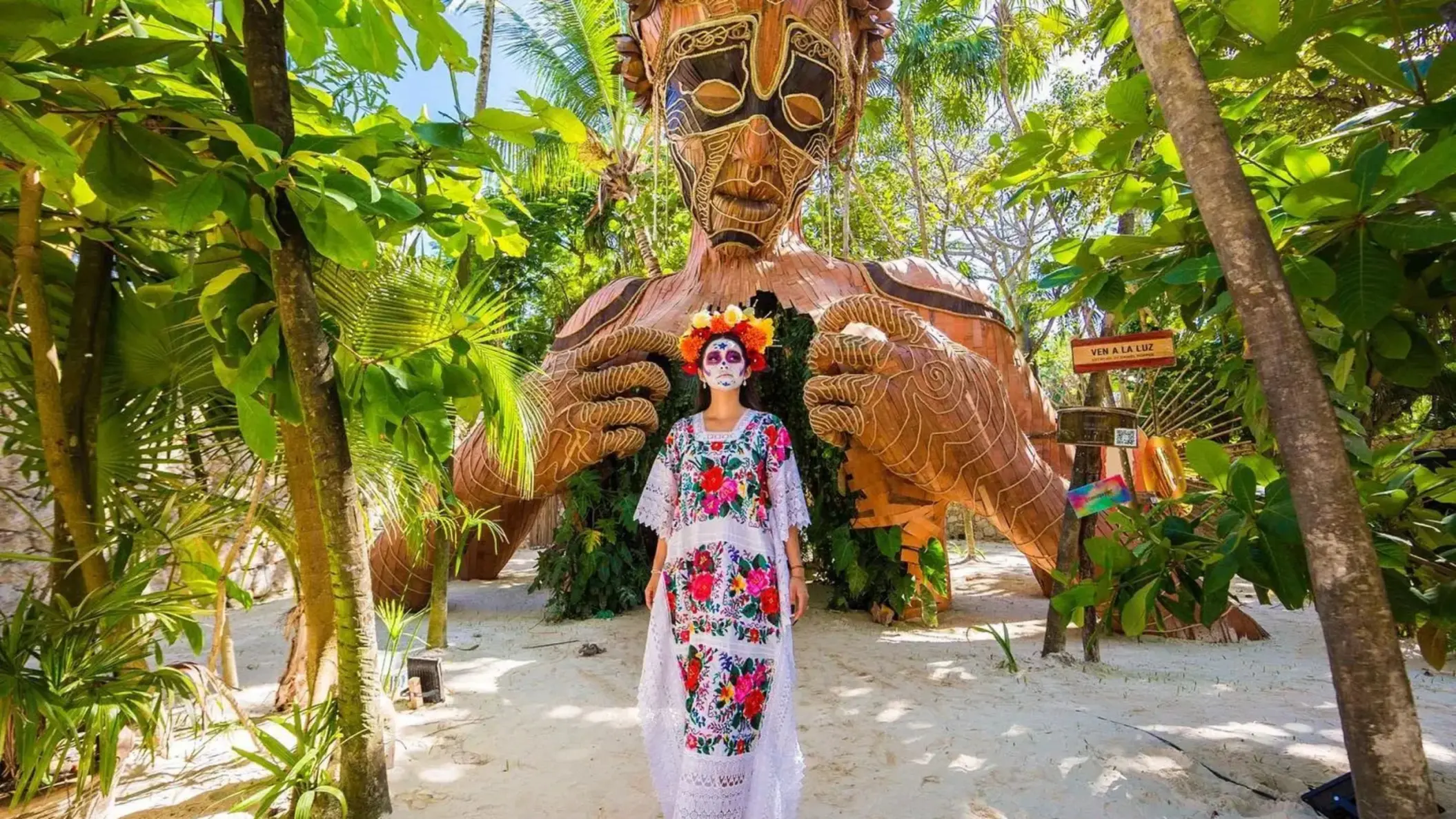 lady in festive attire stading outside Ahau Tulum