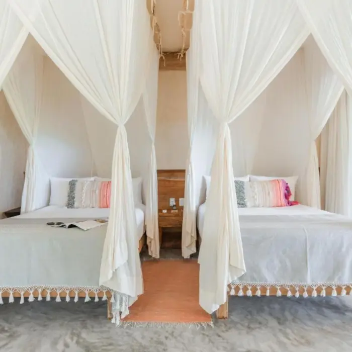 suite with two beds at Ahau Tulum
