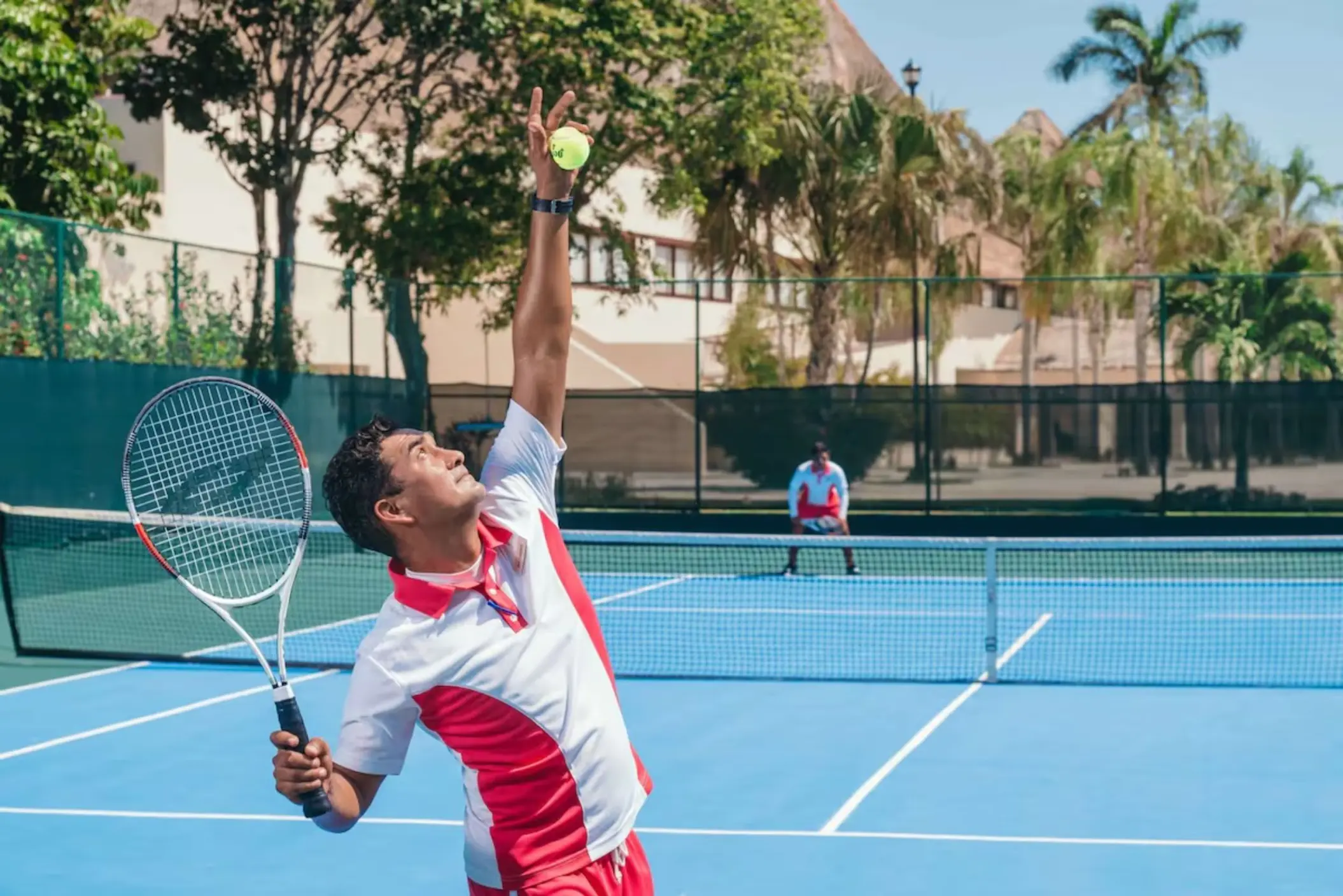 two men playing tennis at Allegro Playacar