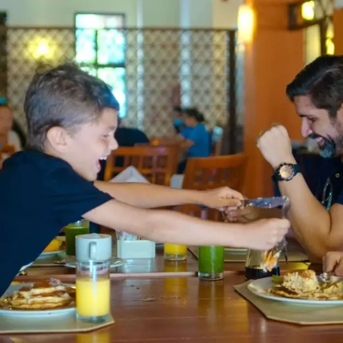 family at a restaurant at Allegro Playacar