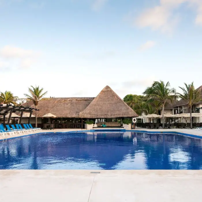 pool with poolside bar at Allegro Playacar
