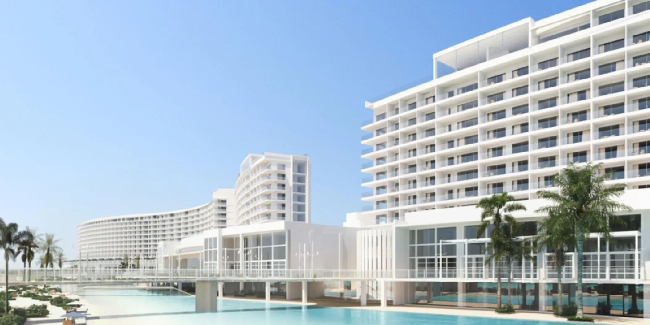 An architectural shot of the modern, white AVA Cancun resort buildings with a pool and palm trees.