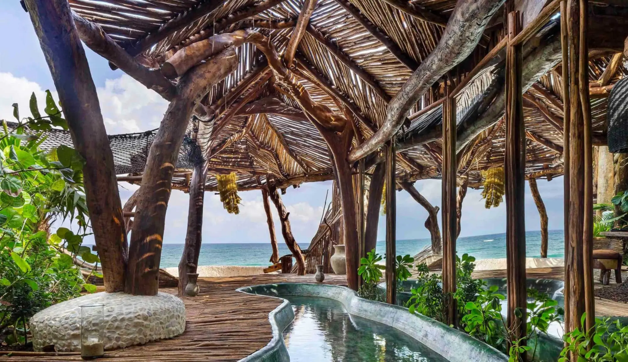 Azulik Tulum pool and rustic wooden elements