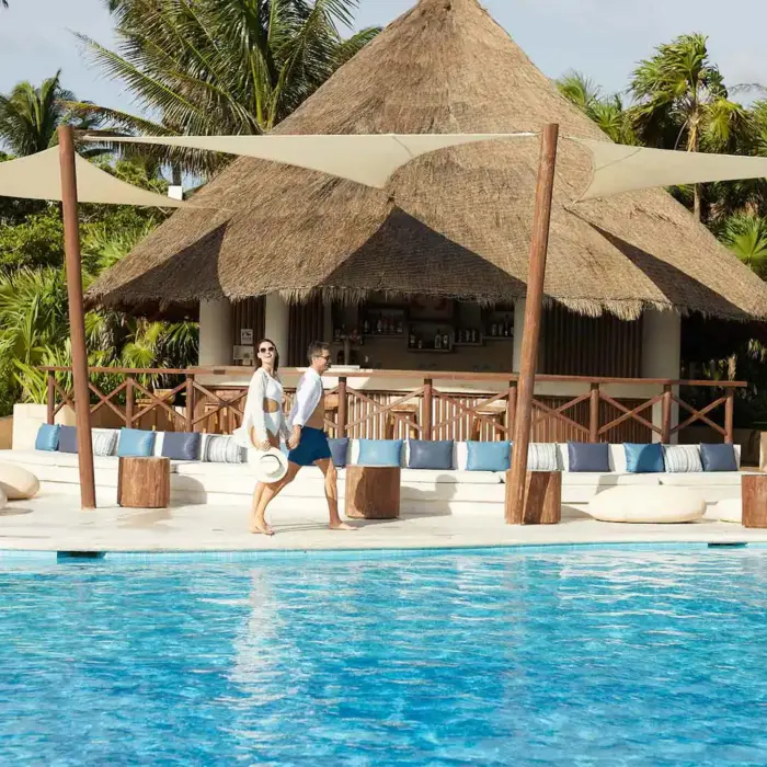 couple at the poolside bar at Bahia Principe Grand Tulum
