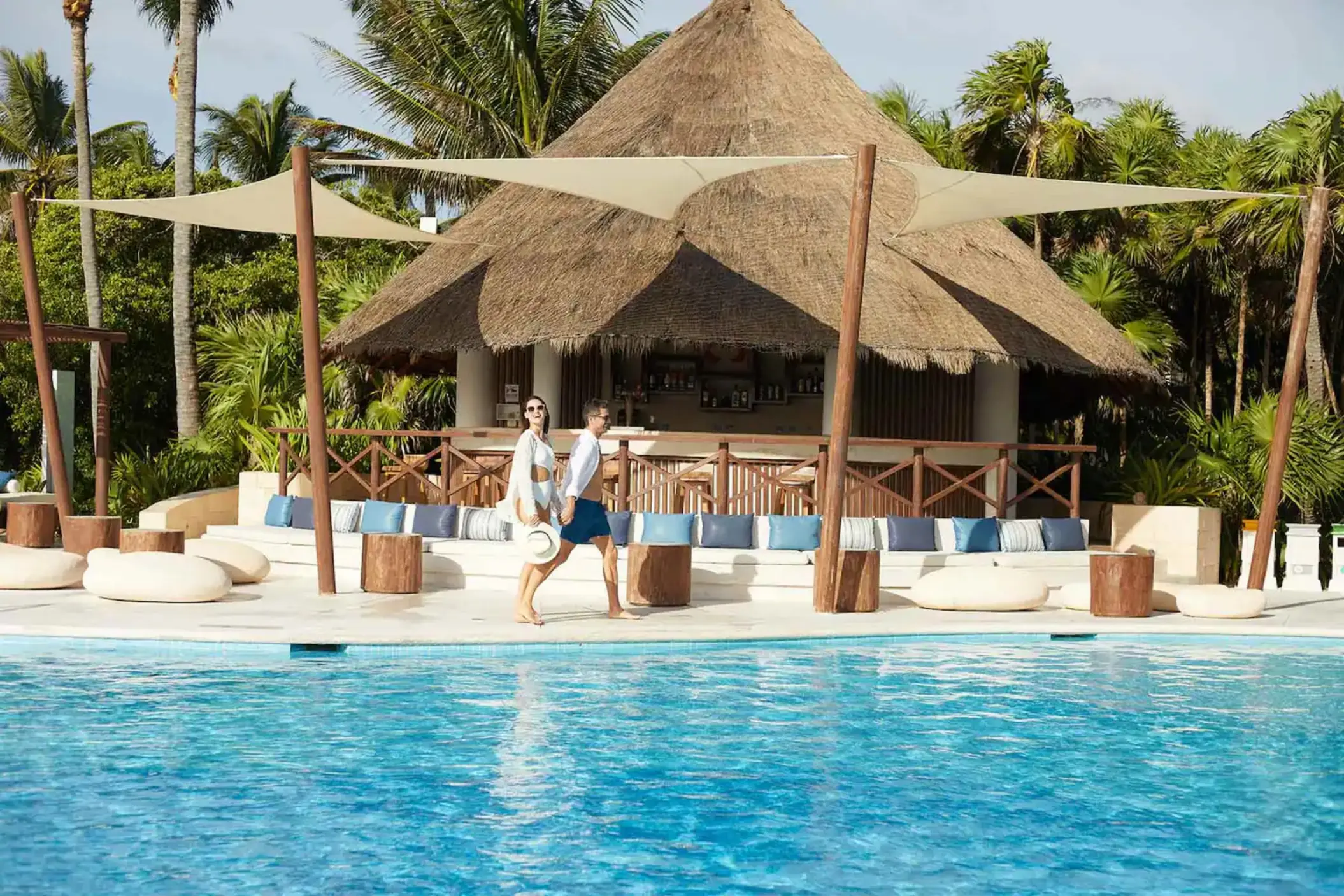 couple at the poolside bar at Bahia Principe Grand Tulum