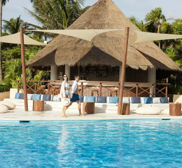 couple at the poolside bar at Bahia Principe Grand Tulum