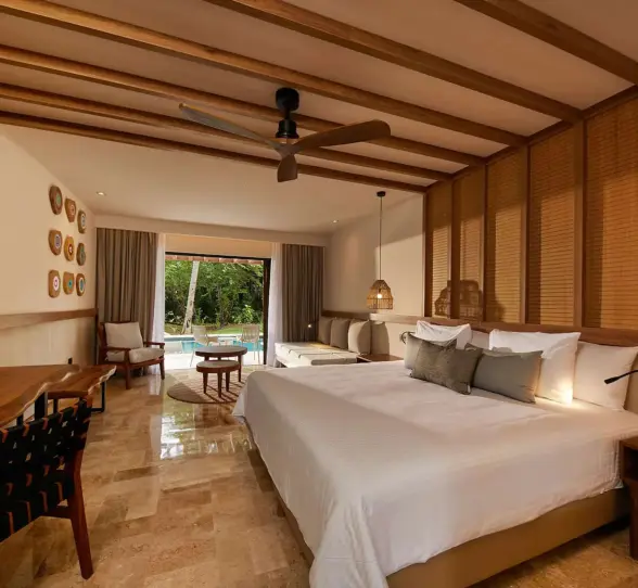 suite with king bed at Bahia Principe Luxury Akumal