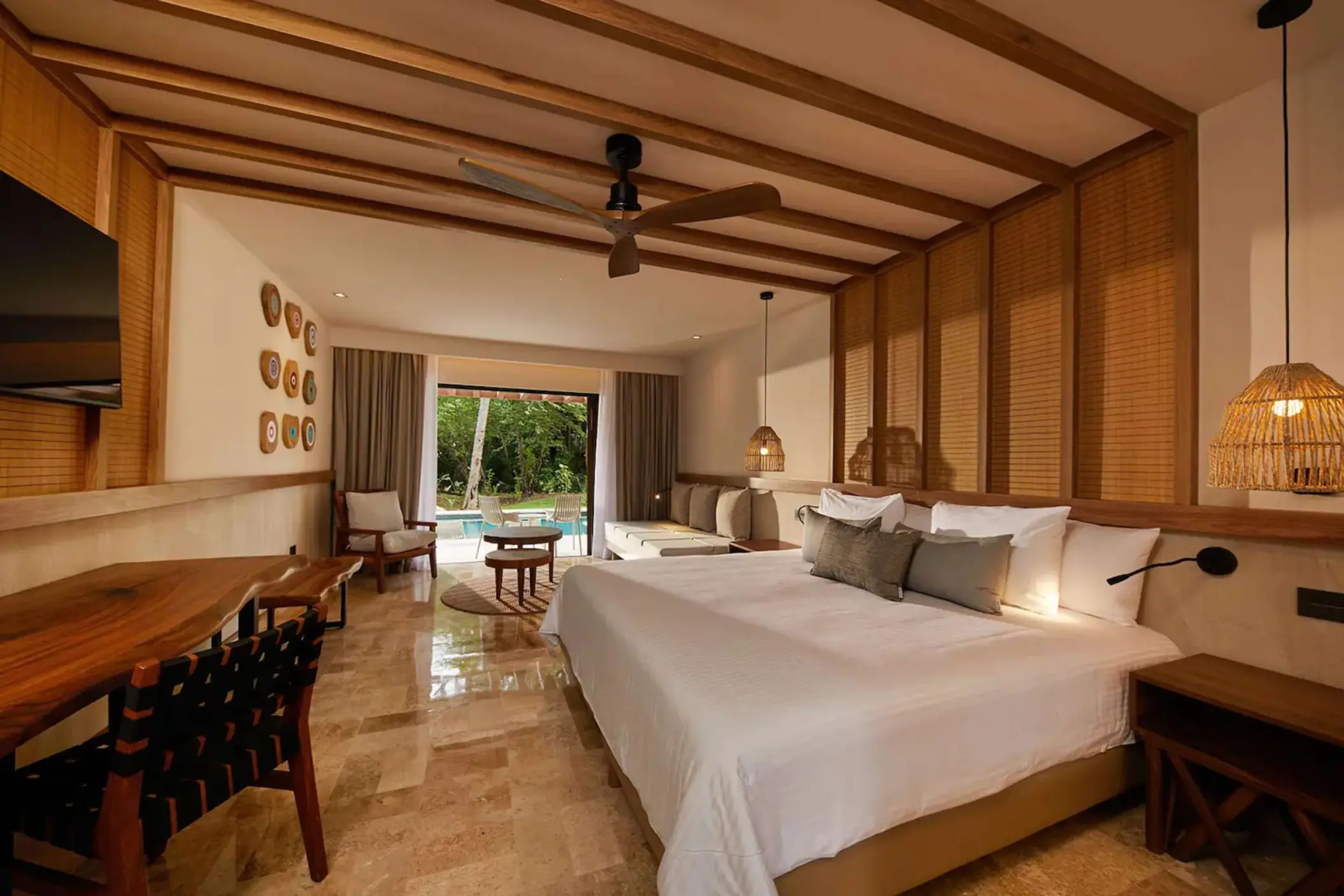 suite with king bed at Bahia Principe Luxury Akumal
