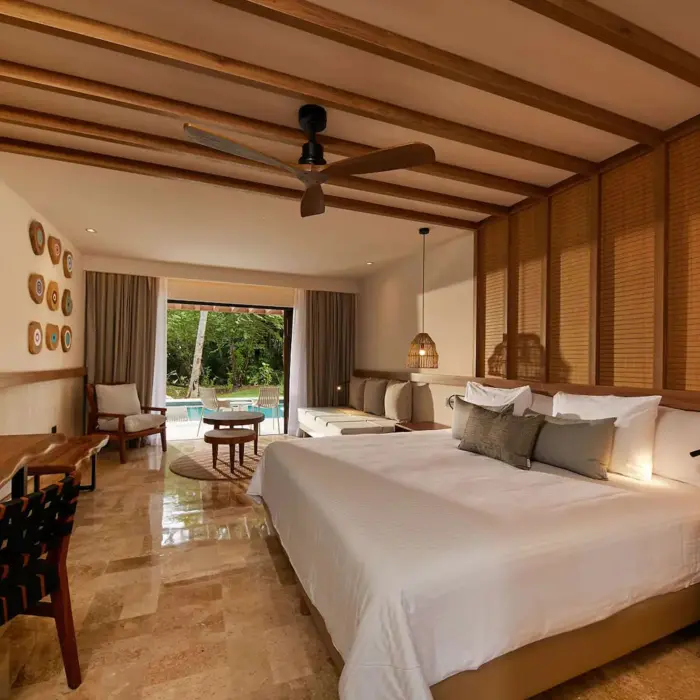 suite with king bed at Bahia Principe Luxury Akumal