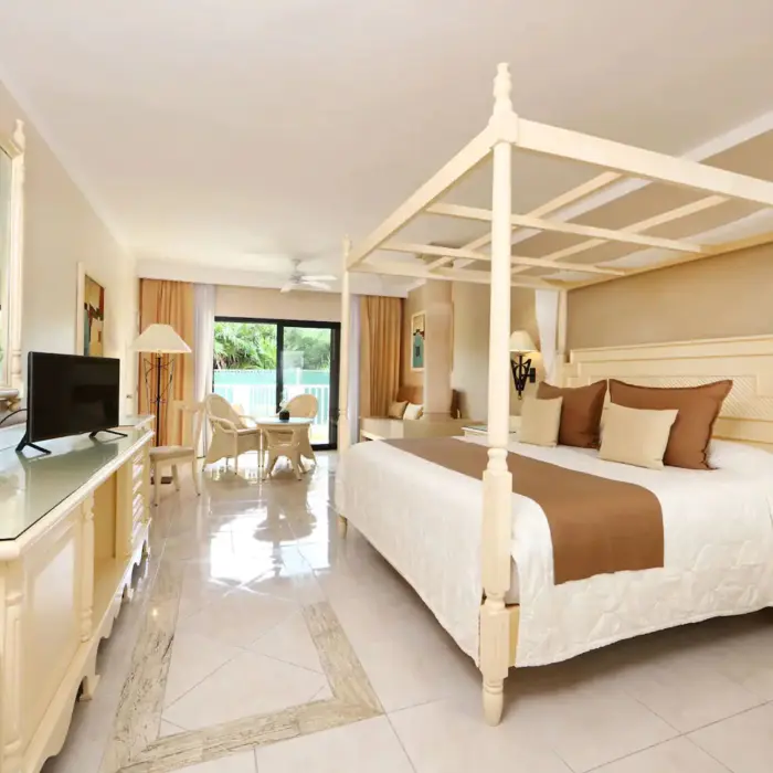 suite with poster bed at Bahia Principe Luxury Akumal