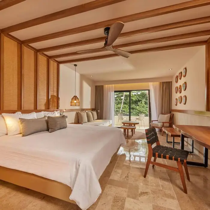 suite with rustic wooden fittings at Bahia Principe Luxury Akumal