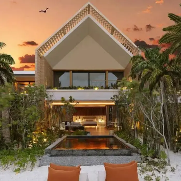 exterior of the beautiful pool suite at dusk at Banyan Tree Mayakoba