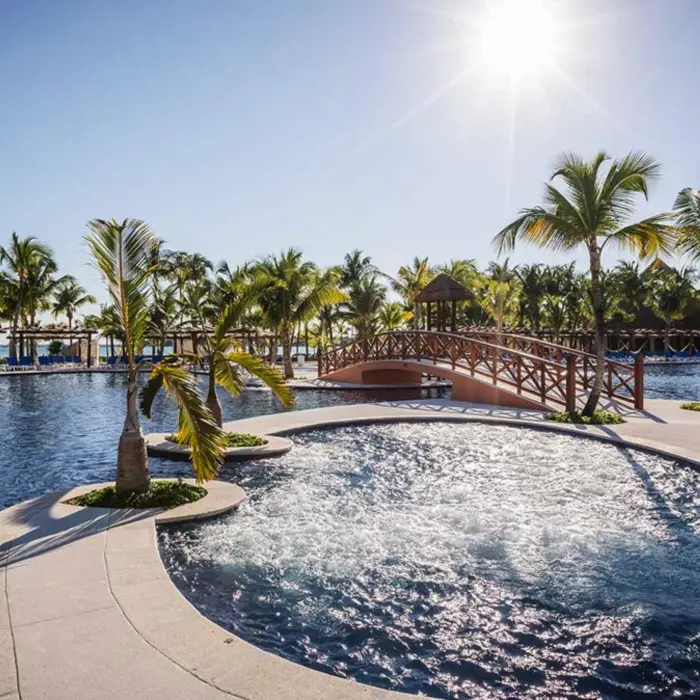 pool at Barcelo Maya Caribe with bridge over it