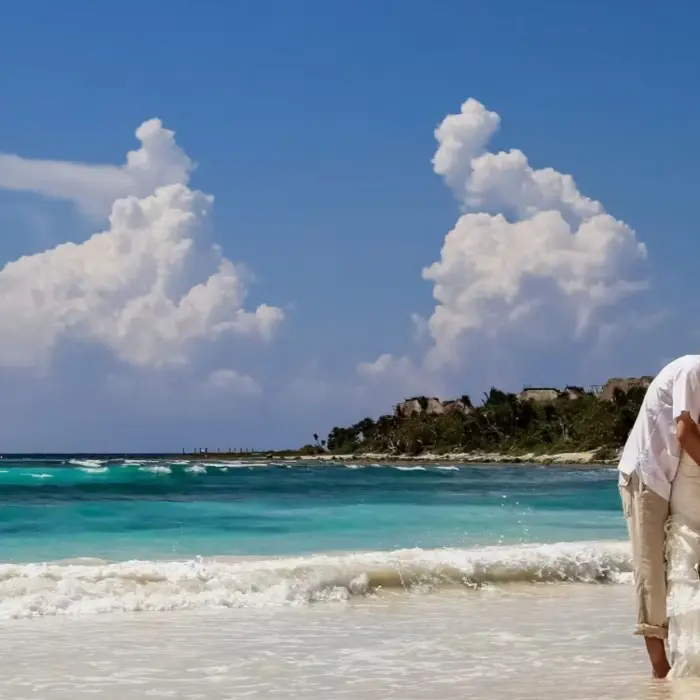 bride and groom on the beach at Barcelo Maya Palace