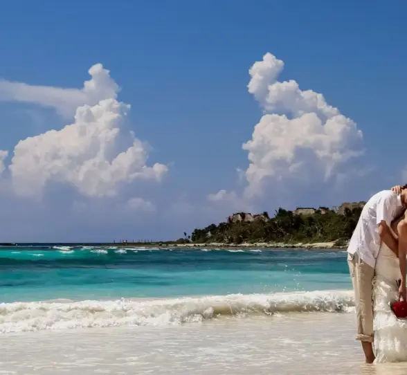 bride and groom on the beach at Barcelo Maya Palace