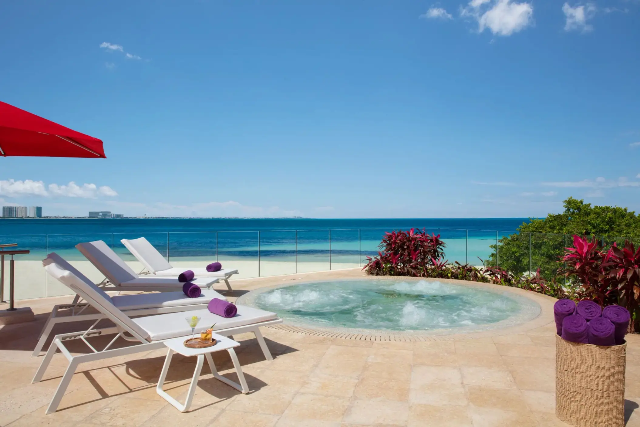Private oceanfront whirlpool with sun loungers and a stunning Caribbean Sea view at Breathless Cancun Soul.