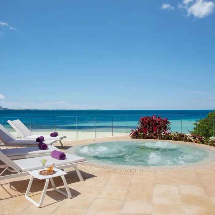 Private oceanfront whirlpool with sun loungers and a stunning Caribbean Sea view at Breathless Cancun Soul.