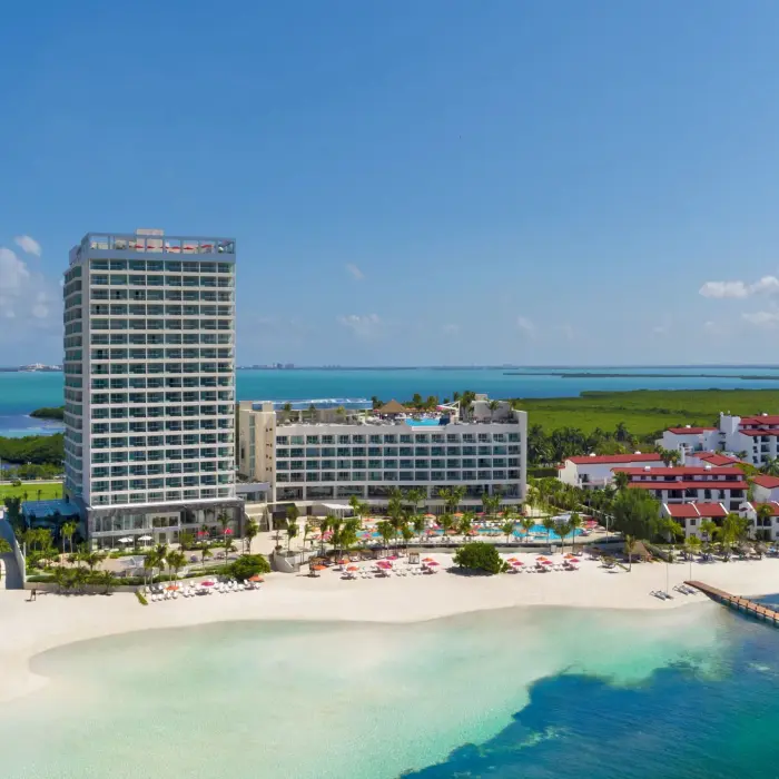 Aerial view of the entire resort complex with beachfront and turquoise waters at Breathless Cancun Soul.