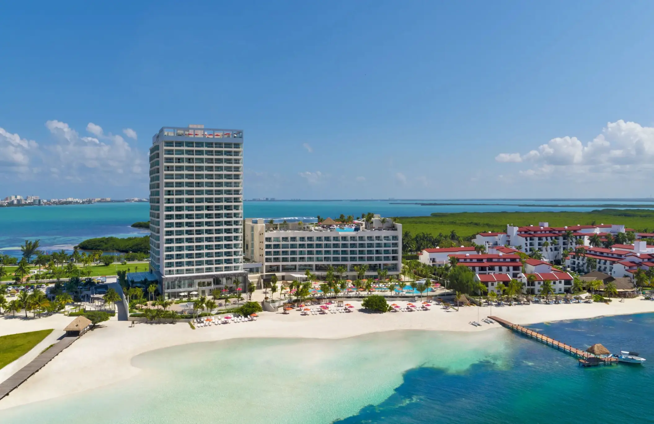 Aerial view of the entire resort complex with beachfront and turquoise waters at Breathless Cancun Soul.