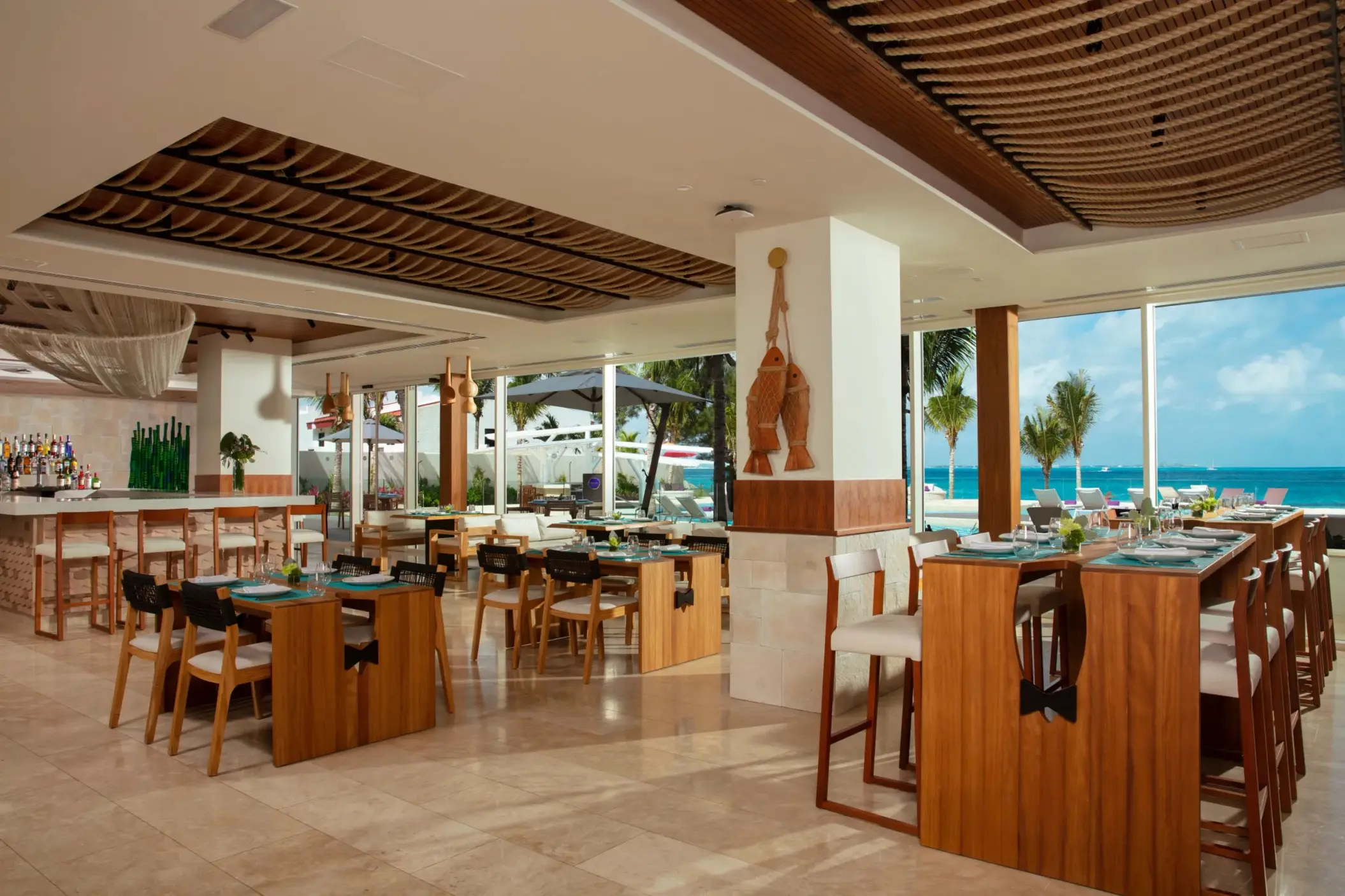 Bright and beachy interior of Fish Nets restaurant with ocean views and nautical-inspired design.