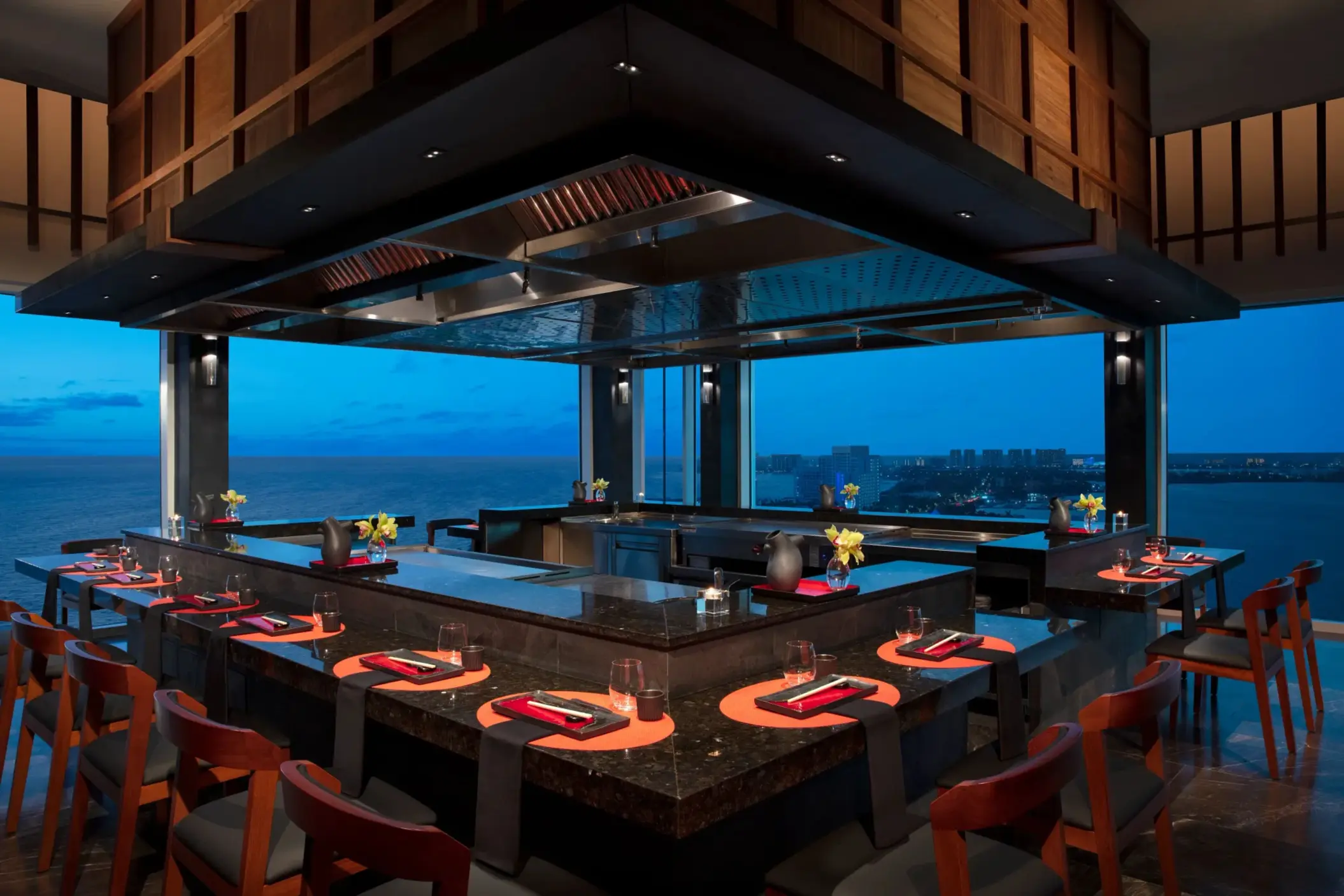 Teppanyaki station at Silk City restaurant with ocean views and interactive dining layout.